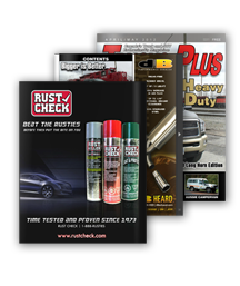 RustCheck magazine ad featuring rust inhibitor spray cans, with other automotive magazines behind it